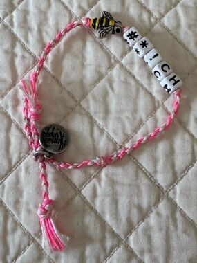 Venessa Arizaga bracelet features a cheeky phrase on white beads and a bee charm